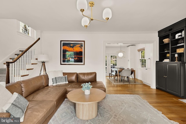 110 E Nelson Ave, Alexandria, VA 22301 - living area featuring wood finished floors, ornamental molding, stairway, a chandelier, and built in shelves