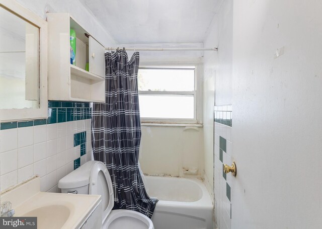 18 Bendix Ln, Willingboro, NJ 08046 - full bath with tile walls, shower / bath combo, vanity, and tasteful backsplash