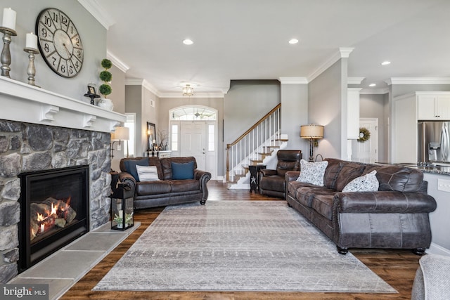 211 Hauer Ter, Spring Grove, PA 17362 - living area with dark wood-type flooring, crown molding, stairway, recessed lighting, and a fireplace