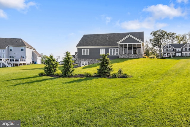 211 Hauer Ter, Spring Grove, PA 17362 - rear view of house featuring a sunroom and a yard