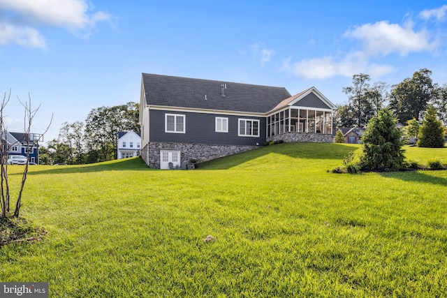 211 Hauer Ter, Spring Grove, PA 17362 - rear view of property with a sunroom, a yard, and roof with shingles