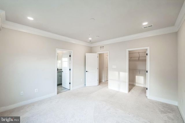 4351 Laplata Ave, Baltimore, MD 21211 - unfurnished bedroom featuring ornamental molding, light colored carpet, a walk in closet, recessed lighting, and a closet