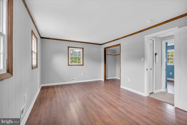 324 W Clayton Ave, Clayton, NJ 08312 - unfurnished bedroom featuring crown molding, wood finished floors, and a closet