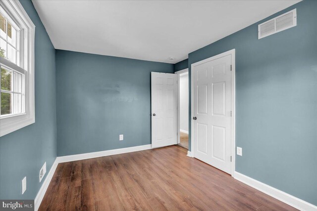 324 W Clayton Ave, Clayton, NJ 08312 - unfurnished bedroom featuring wood finished floors and baseboards