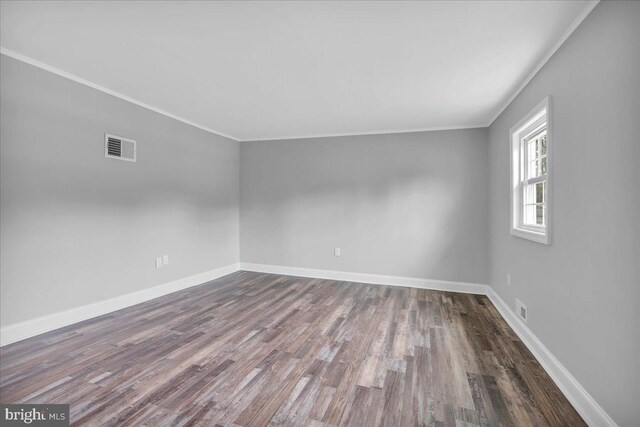 324 W Clayton Ave, Clayton, NJ 08312 - unfurnished room with crown molding and dark wood-style floors