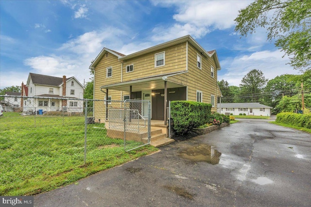 324 W Clayton Ave, Clayton, NJ 08312 - view of front of home featuring covered porch and asphalt driveway