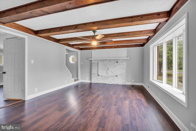 324 W Clayton Ave, Clayton, NJ 08312 - unfurnished living room with a ceiling fan, beamed ceiling, wood finished floors, and a brick fireplace
