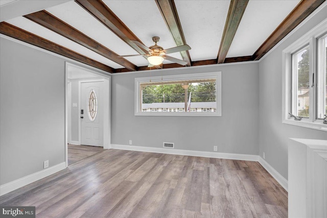 324 W Clayton Ave, Clayton, NJ 08312 - empty room featuring a ceiling fan, beamed ceiling, and wood finished floors