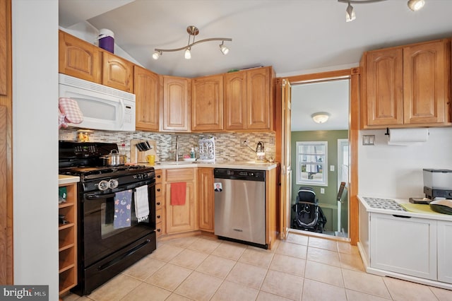 325 Beecher Ave, Cheltenham, PA 19012 - kitchen with black range with gas stovetop, white microwave, stainless steel dishwasher, light countertops, and decorative backsplash