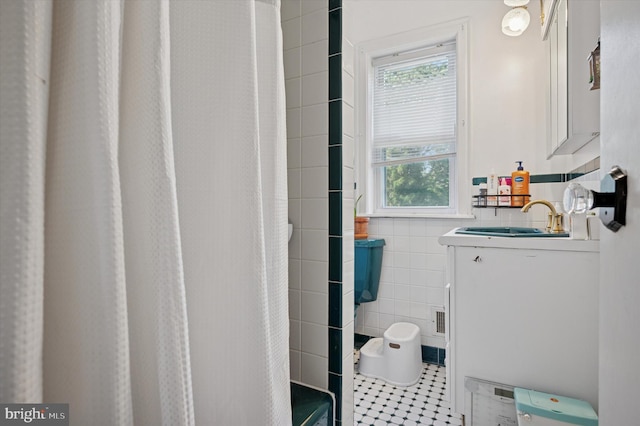 325 Beecher Ave, Cheltenham, PA 19012 - bathroom with tile walls, tile patterned floors, vanity, a shower with curtain, and a wainscoted wall