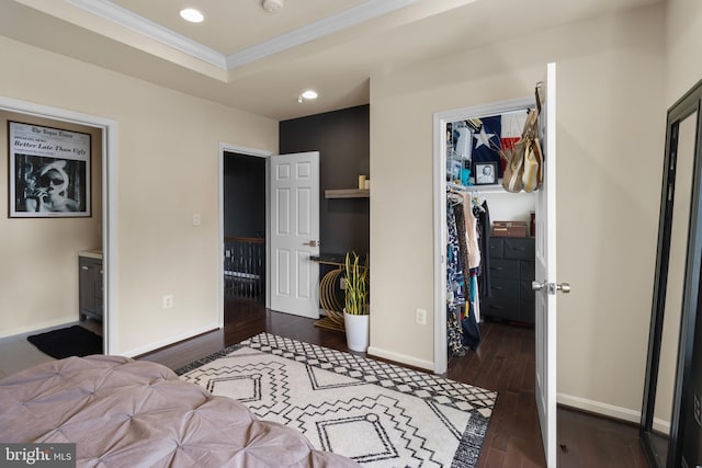 1778 W St SE, Washington, DC 20020 - bedroom featuring a spacious closet, ornamental molding, dark wood-style flooring, recessed lighting, and a closet