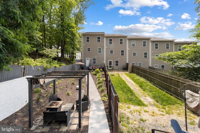 1778 W St SE, Washington, DC 20020 - fenced backyard with a vegetable garden and an outdoor fire pit