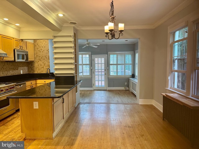 3822 Benton St NW, Washington, DC 20007 - kitchen with radiator heating unit, a chandelier, dark countertops, appliances with stainless steel finishes, and open shelves