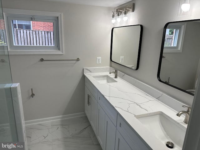 6087 8th Pl N, Arlington, VA 22205 - bathroom featuring double vanity and marble look tile flooring