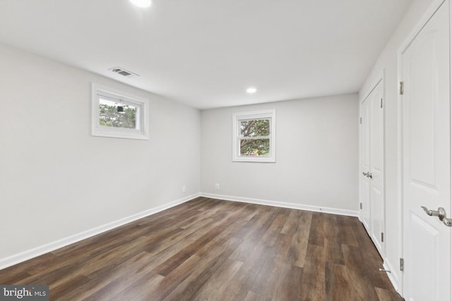 6087 8th Pl N, Arlington, VA 22205 - unfurnished bedroom with dark wood-style floors and recessed lighting