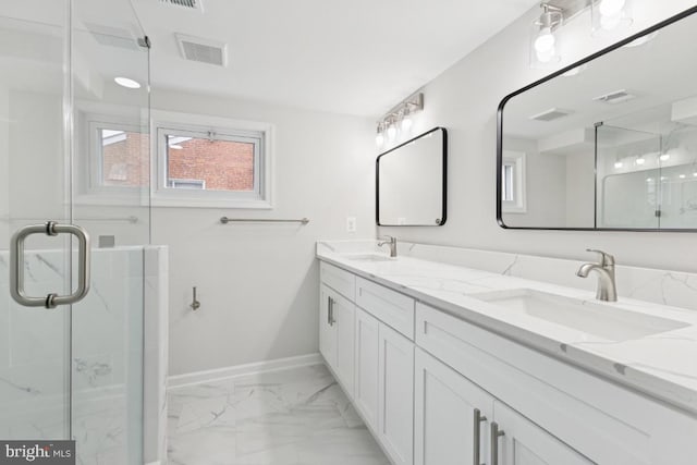 6087 8th Pl N, Arlington, VA 22205 - bathroom featuring marble look tiles, double vanity, and a marble finish shower