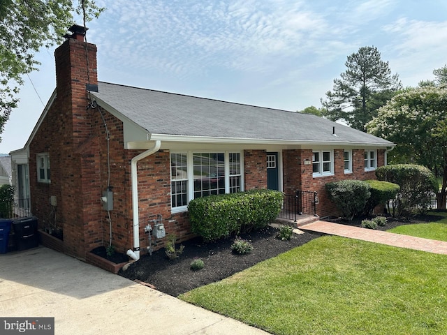 6087 8th Pl N, Arlington, VA 22205 - view of front of home featuring a chimney, a front lawn, brick siding, and roof with shingles