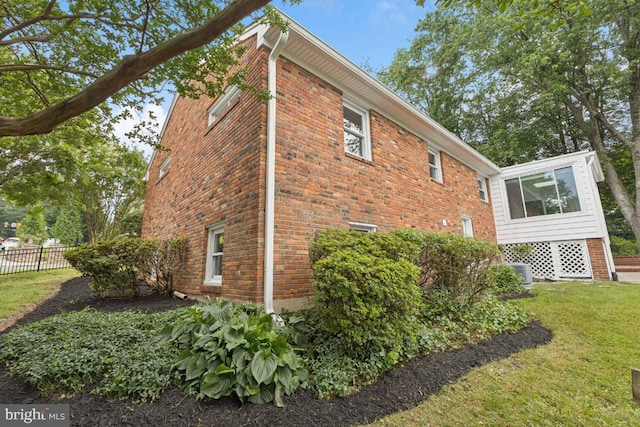 6087 8th Pl N, Arlington, VA 22205 - view of property exterior featuring brick siding and a sunroom