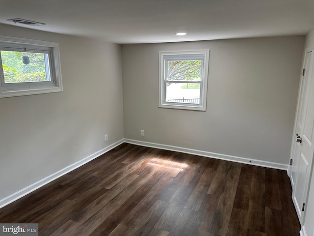 6087 8th Pl N, Arlington, VA 22205 - empty room with healthy amount of natural light, dark wood finished floors, and recessed lighting