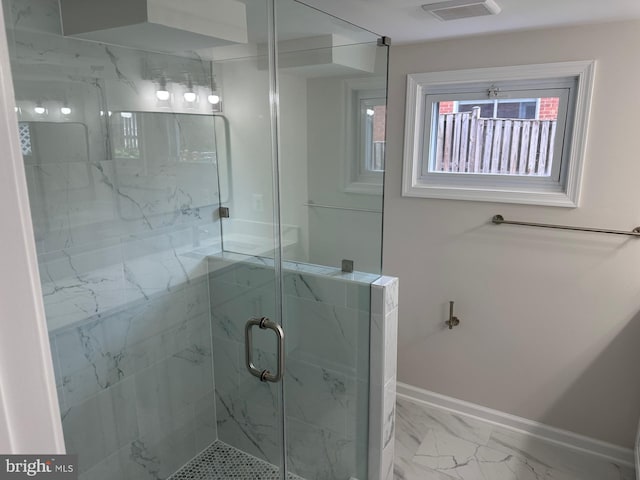 6087 8th Pl N, Arlington, VA 22205 - bathroom featuring marble look tile flooring, a marble finish shower, and healthy amount of natural light