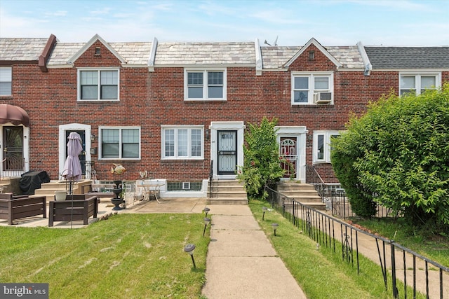 1319 E Vernon Rd, Philadelphia, PA 19150 - townhome / multi-family property featuring a high end roof, brick siding, entry steps, and cooling unit