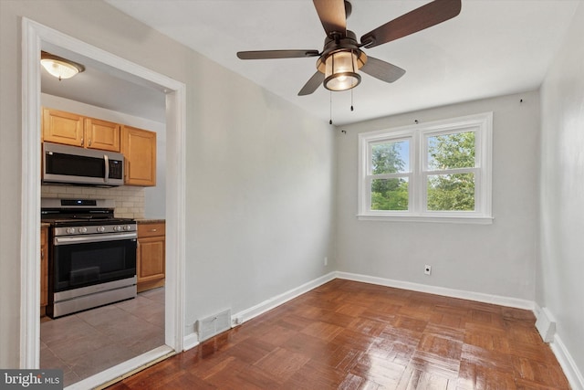 1319 E Vernon Rd, Philadelphia, PA 19150 - kitchen featuring appliances with stainless steel finishes, backsplash, ceiling fan, and light brown cabinets