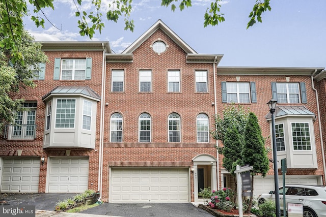 440 Clayton Ln, Alexandria, VA 22304 - view of property with a garage, driveway, and brick siding