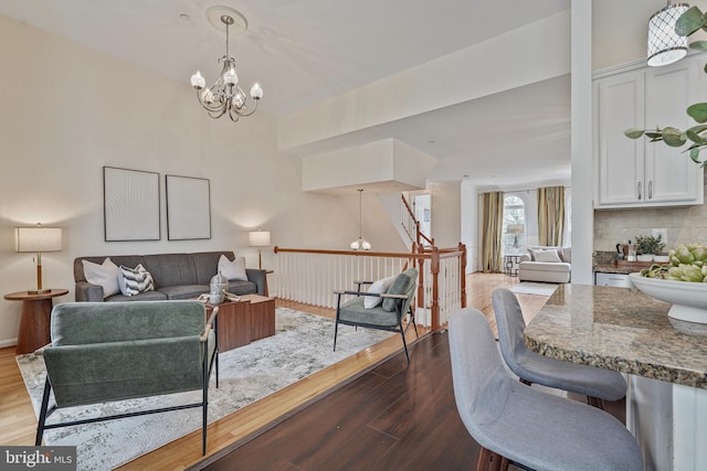 440 Clayton Ln, Alexandria, VA 22304 - living room with a chandelier and dark wood finished floors