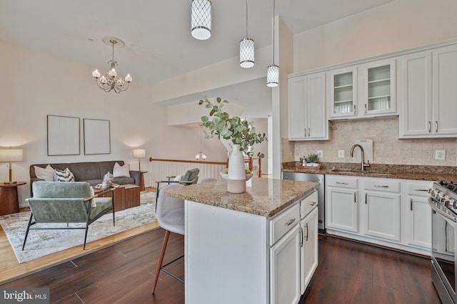 440 Clayton Ln, Alexandria, VA 22304 - kitchen featuring white cabinets, appliances with stainless steel finishes, stone countertops, and dark wood-style flooring