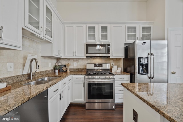 440 Clayton Ln, Alexandria, VA 22304 - kitchen featuring appliances with stainless steel finishes, white cabinetry, and light stone counters