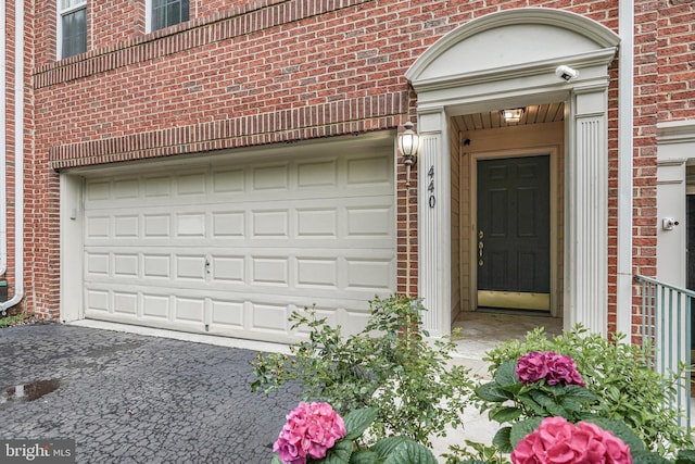 440 Clayton Ln, Alexandria, VA 22304 - entrance to property featuring brick siding, a garage, and driveway