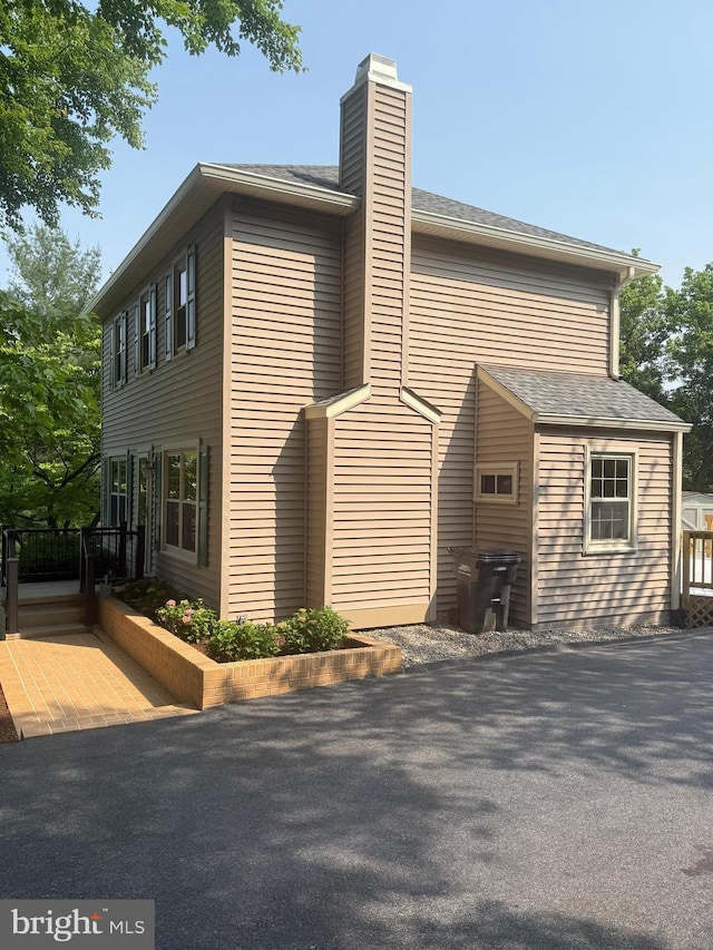 10804 Glade Ct N, New Market, MD 21774 - view of property exterior with a chimney and a deck