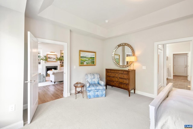 312 Avondale Ln, Crozet, VA 22932 - bedroom featuring carpet floors, a warm lit fireplace, and a tray ceiling