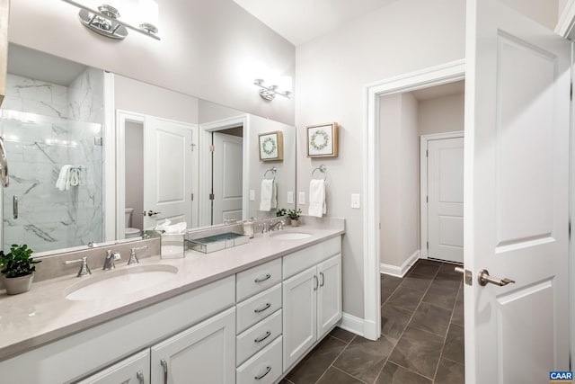 312 Avondale Ln, Crozet, VA 22932 - bathroom with double vanity, a marble finish shower, and marble look tile flooring