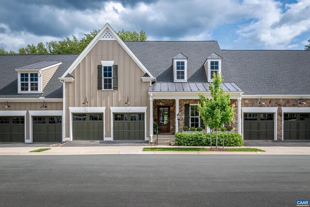 312 Avondale Ln, Crozet, VA 22932 - view of front of home featuring board and batten siding, a standing seam roof, stone siding, and a shingled roof