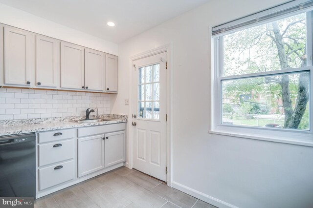 421 Jefferson St NE, Washington, DC 20011 - kitchen with black dishwasher, plenty of natural light, backsplash, light stone countertops, and recessed lighting