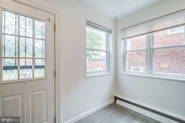 421 Jefferson St NE, Washington, DC 20011 - doorway featuring a baseboard radiator and light tile patterned flooring