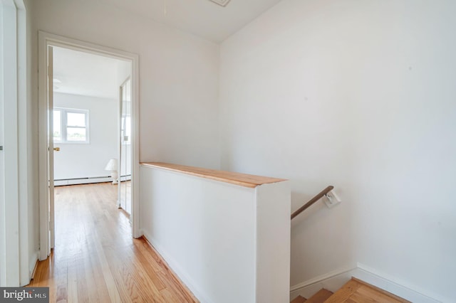 421 Jefferson St NE, Washington, DC 20011 - corridor featuring an upstairs landing, baseboard heating, and light wood-type flooring