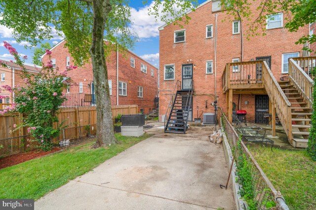 421 Jefferson St NE, Washington, DC 20011 - rear view of house featuring stairs, brick siding, and a deck