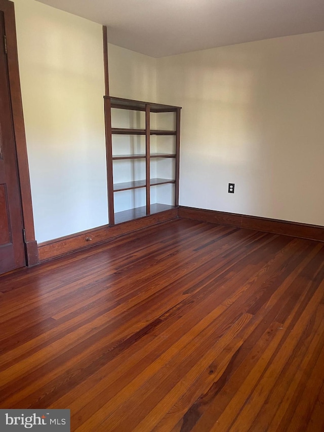 15004 Leetown Rd, Kearneysville, WV 25430 - empty room featuring dark wood-type flooring and baseboards