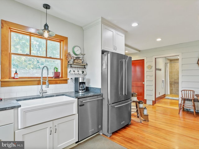15004 Leetown Rd, Kearneysville, WV 25430 - kitchen with appliances with stainless steel finishes, light wood-style floors, white cabinets, recessed lighting, and decorative backsplash