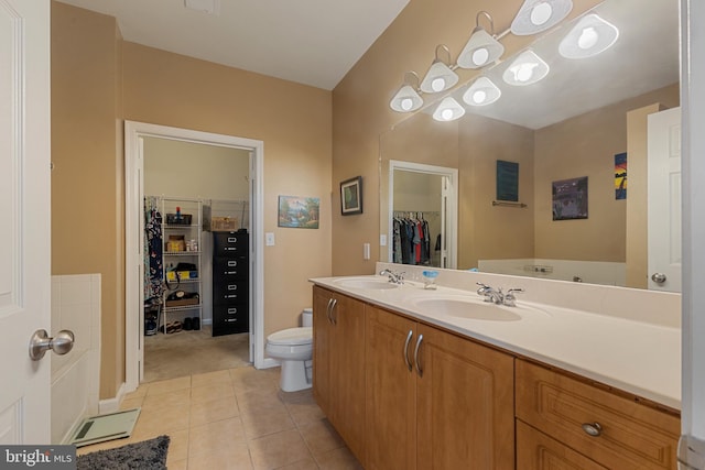 12921 Centre Park Cir Unit 102, Herndon, VA 20171 - full bath with a spacious closet, double vanity, and tile patterned floors