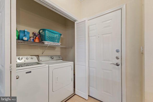 12921 Centre Park Cir Unit 102, Herndon, VA 20171 - washroom featuring washing machine and dryer and light tile patterned flooring