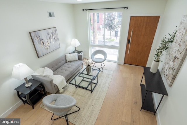 622 Mcclellan St, Philadelphia, PA 19148 - living room featuring light wood-type flooring and baseboards