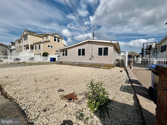 51 Ralph Ln, Manahawkin, NJ 08050 - rear view of house featuring a residential view and crawl space