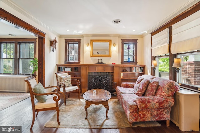 4009 Oglethorpe St, Hyattsville, MD 20782 - sitting room with hardwood / wood-style flooring, a fireplace, ornamental molding, and radiator