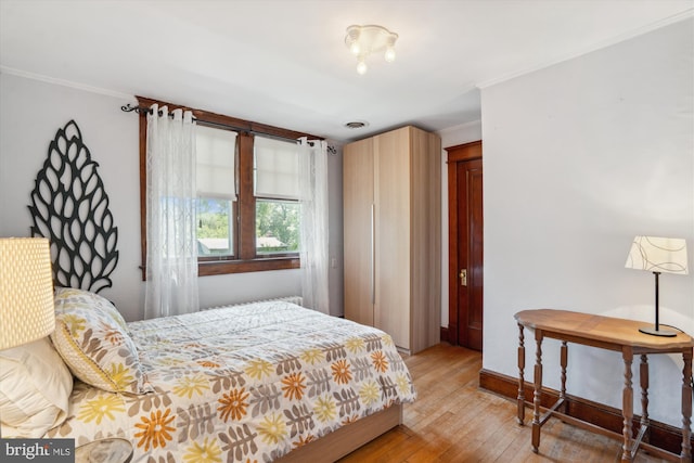 4009 Oglethorpe St, Hyattsville, MD 20782 - bedroom with light wood finished floors and ornamental molding