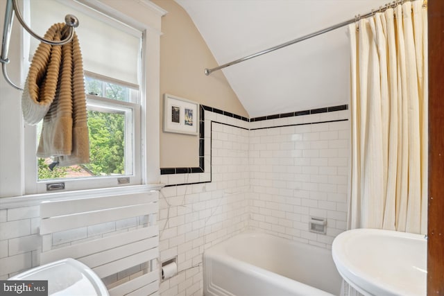 4009 Oglethorpe St, Hyattsville, MD 20782 - full bath featuring vaulted ceiling, shower / bath combination with curtain, and tile walls