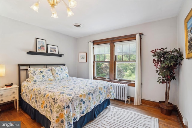 4009 Oglethorpe St, Hyattsville, MD 20782 - bedroom featuring radiator heating unit and hardwood / wood-style flooring
