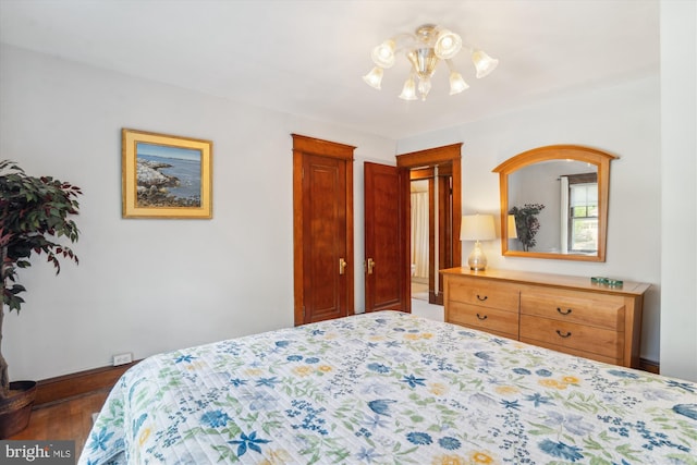 4009 Oglethorpe St, Hyattsville, MD 20782 - bedroom featuring a chandelier and wood finished floors
